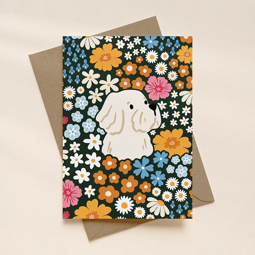 Greeting card with a white terrier dog surrounded by colorful flowers on a patterned background
