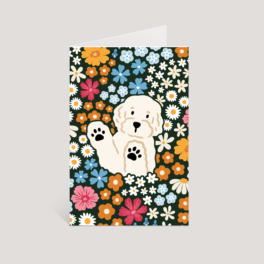 Greeting card with a white dog illustration on a floral background