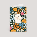 Greeting card with a terrier dog surrounded by colorful flowers on a dark green background