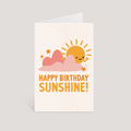 Greeting card with a sun and clouds design and 'Happy Birthday Sunshine!' text on a light gray background.