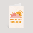 Greeting card with a sun and clouds design and 'Happy Birthday Sunshine!' text on a light gray background.