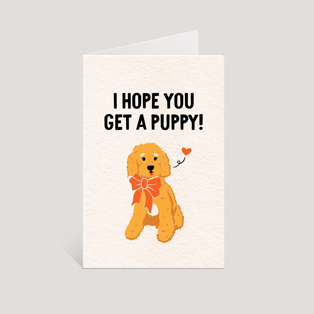 Greeting card with a cartoon dog and text 'I hope you get a puppy!' on a light gray background