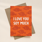 Orange card with soy sauce fish pattern and 'I Love You Soy Much' text on a beige background