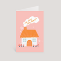 Greeting card with a house illustration and 'no place like home' text on a pink background
