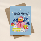 Christmas card with a dog wearing a Santa hat and presents on a blue background