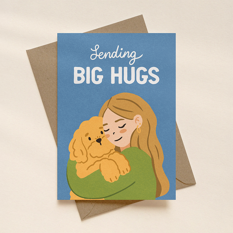 Greeting card with illustration of a person hugging a dog and text 'Sending BIG HUGS' on a beige background.