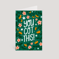 Greeting card with 'You Got This!' text and floral design on a green background